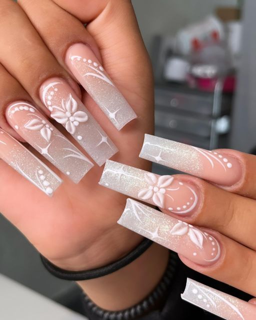 Stunning Floral-Designed Long Nails in Soft Pastels for a Sophisticated Look.