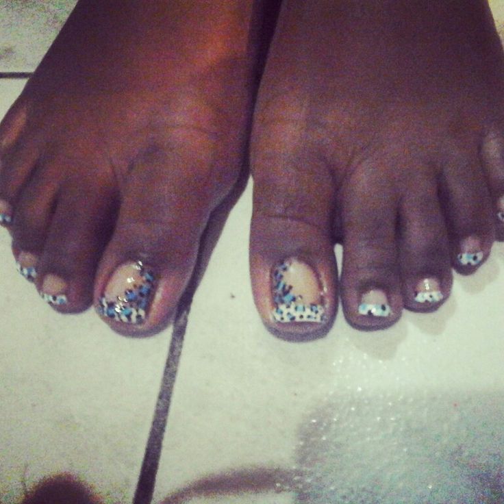 Playful Animal Print Pedicure with Beige, Black, and Blue Accents.