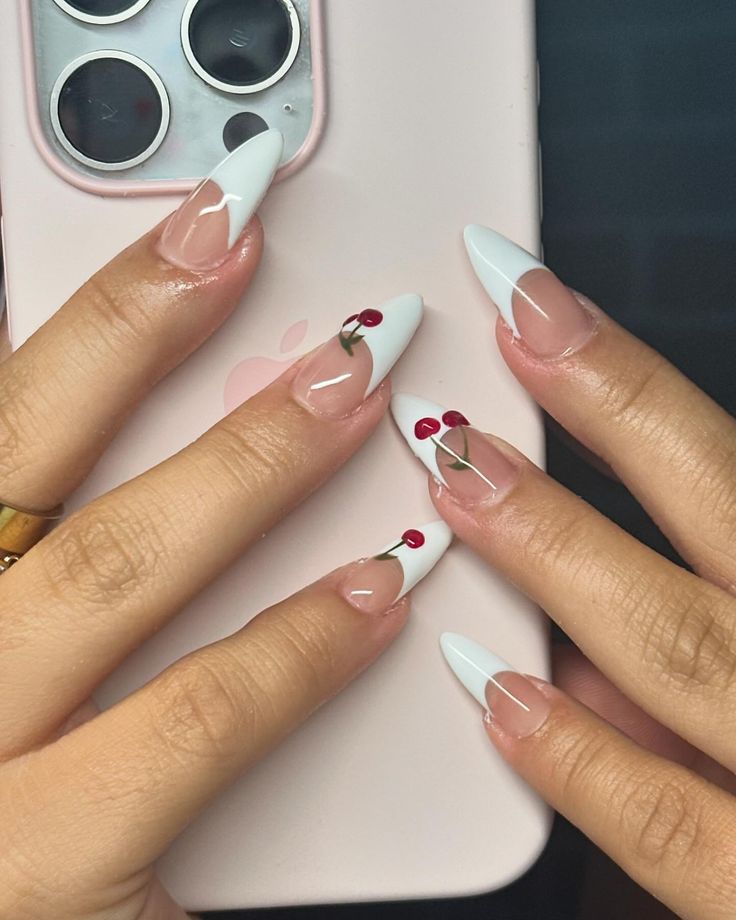 Elegant French Tip Nails with Playful Cherry Motif for a Fresh, Stylish Look.