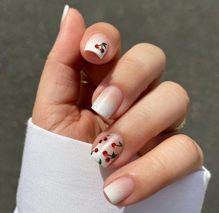 Delicate Cherry-Inspired Nail Design with Ombre Tips and Hand-Painted Accents.