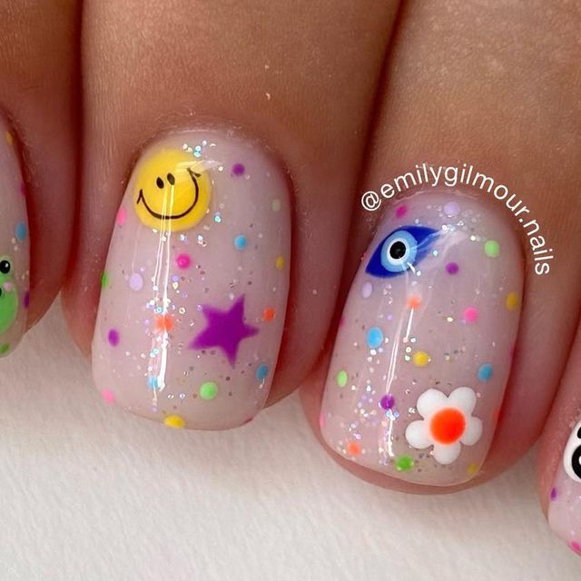 Playful Confetti Nail Design with Charming Icons for a Vibrant Expression.