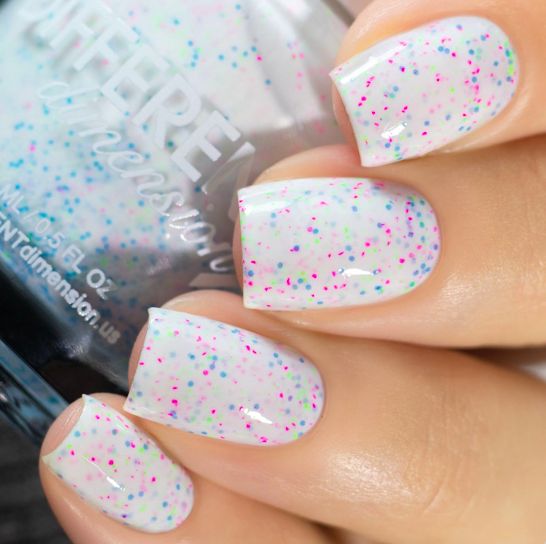 Whimsical Translucent Nail Design with Pastel Pink and Blue Glitter for a Light Spring/Summer Look.