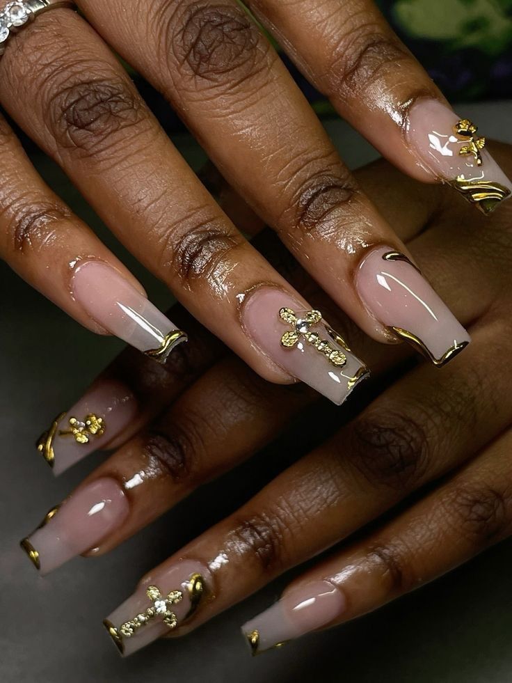 Sophisticated Nude Nail Design with Glossy Finish and Gold Accents.