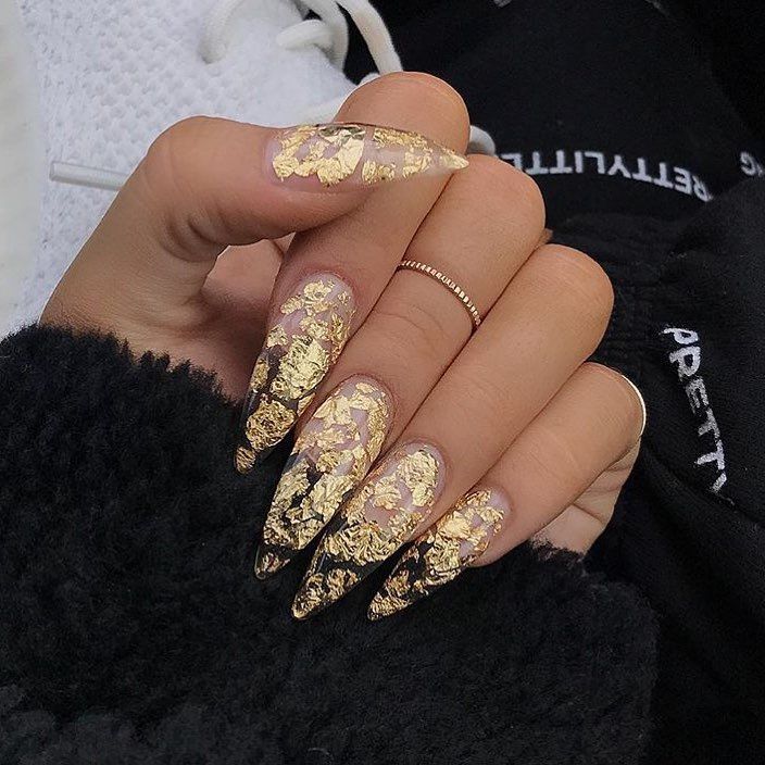 Elegant Elongated Nail Design with Gold Foil and Gradient Tips for Special Occasions.