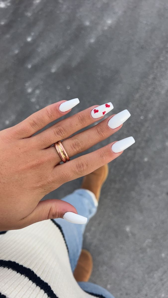 Elegant Chic White Nails with Glossy Finish and Playful Red Heart Accents