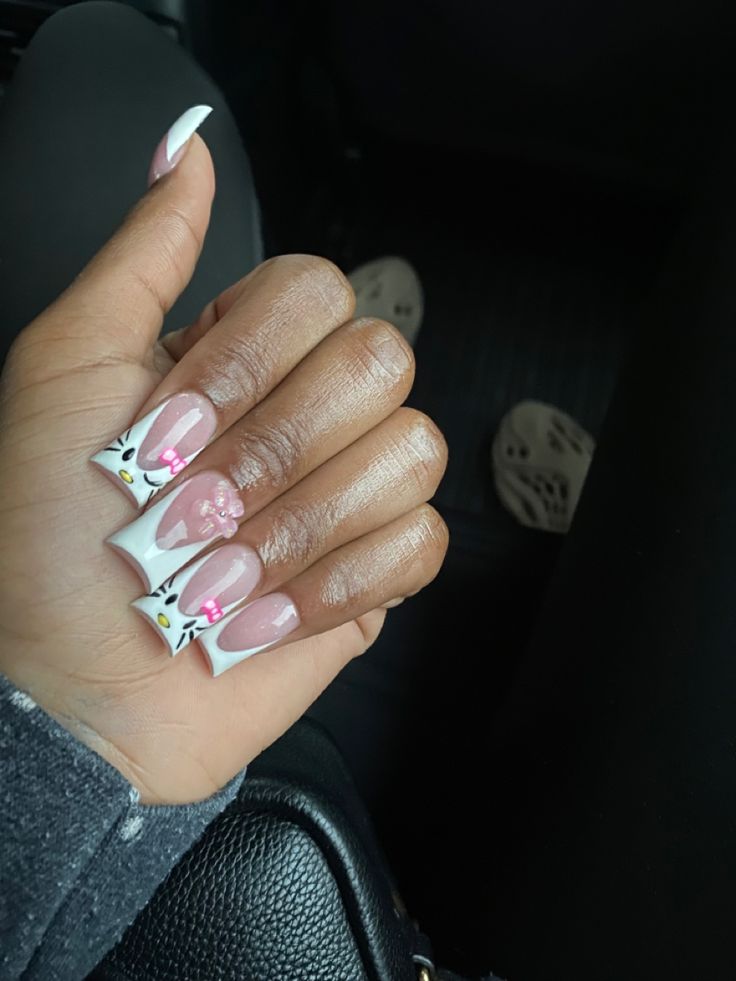 Whimsical Cat-Themed Pink and White Nail Design for a Charming Aesthetic.