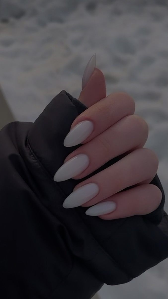 Sophisticated Almond-Shaped Soft White Nails: A Chic Minimalist Design.