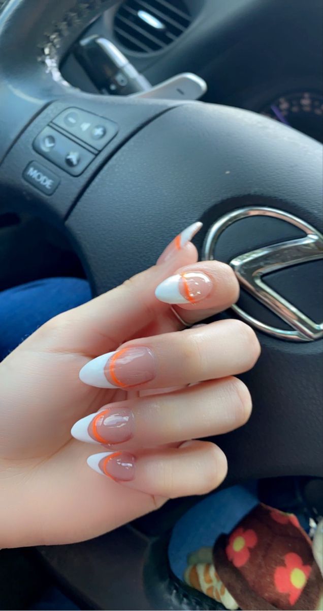 Chic French Tip Nail Design with Vibrant Orange Accent