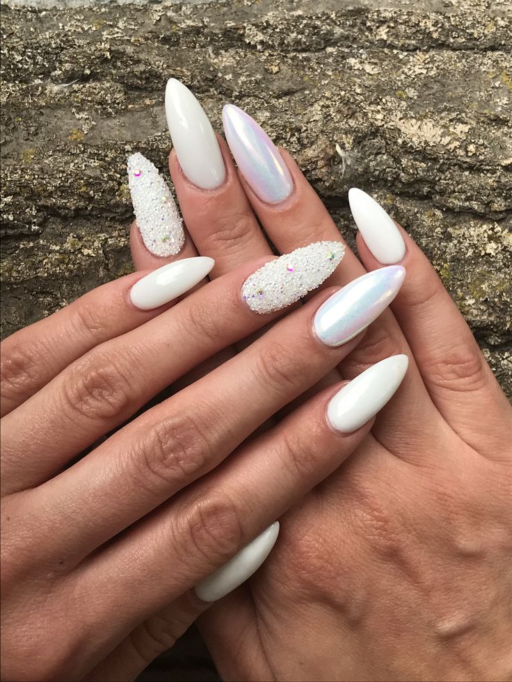 Elegant White Almond-Shaped Nails with Iridescent and Glitter Accents for Glamorous Appeal.