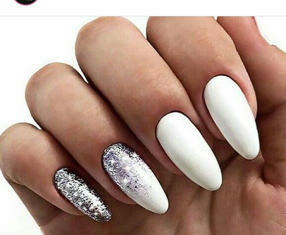 Chic Stiletto Nail Design: Matte White with Glittery Silver Accents for Glamorous Appeal.