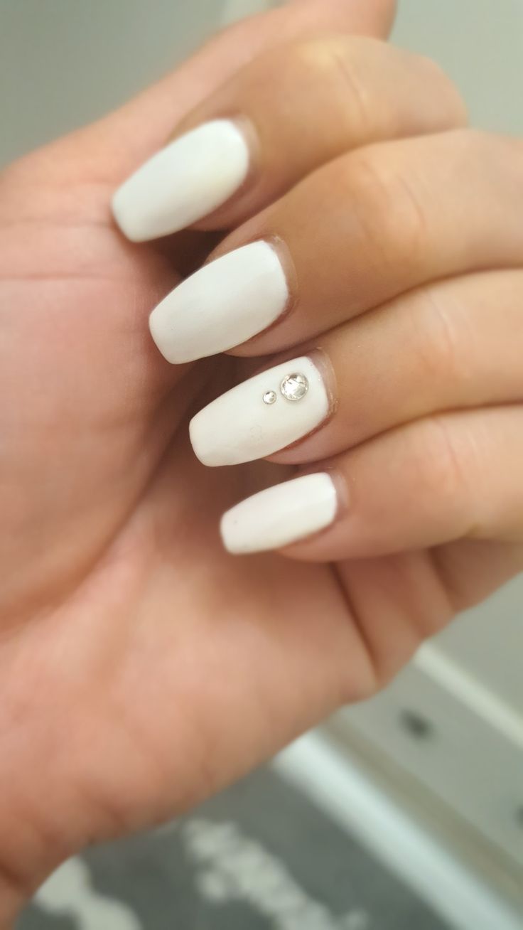 Sophisticated Chic: Elegant White Nails with Rhinestone Accents for Every Occasion