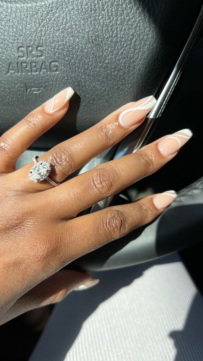 Chic Minimalist Nail Design: Soft Nude Base with Delicate White Accents.