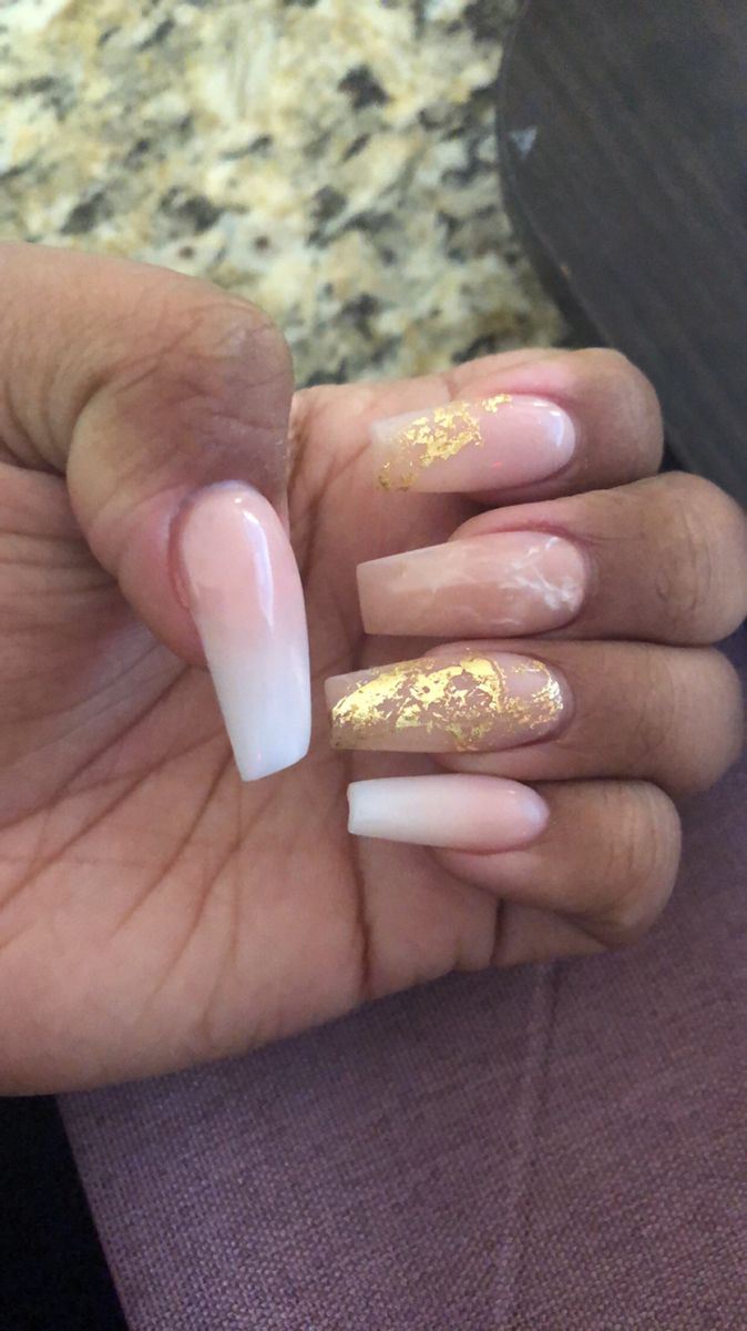 Chic Nail Design: Elegant Pink and White with Gold Foil Accents.