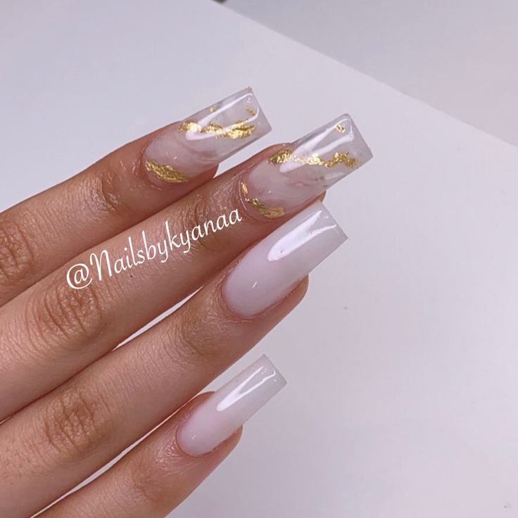 Chic Soft Pink Nail Design with Gold Leaf Accents for Any Occasion.