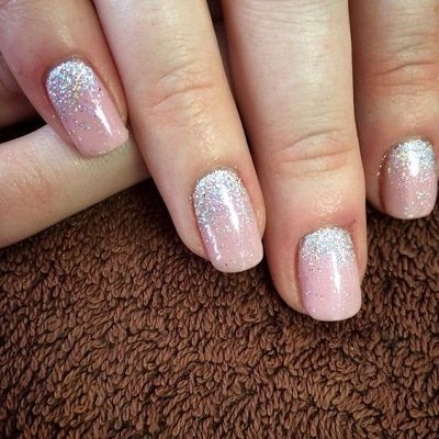 Elegant Sparkling Ombre Nails: A Versatile Design with Subtle Nude Base and Shimmering Silver Tips.