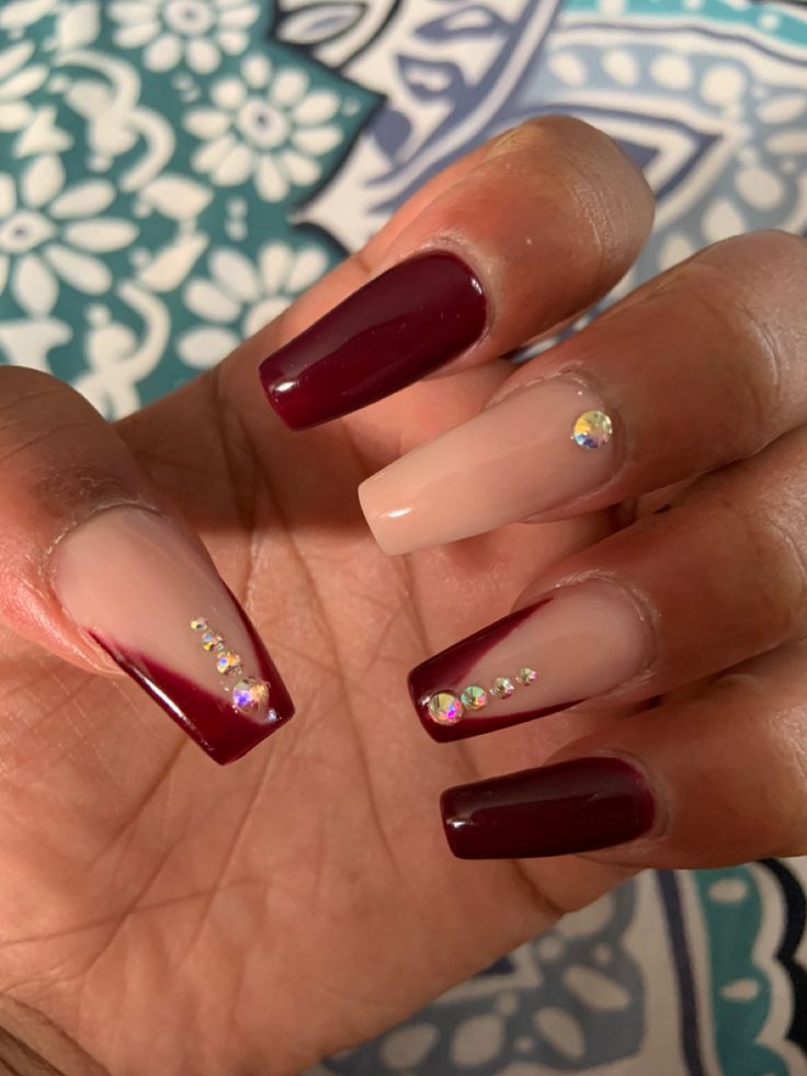 Chic Deep Burgundy and Soft Nude Gradient Nail Design with Sparkling Rhinestones