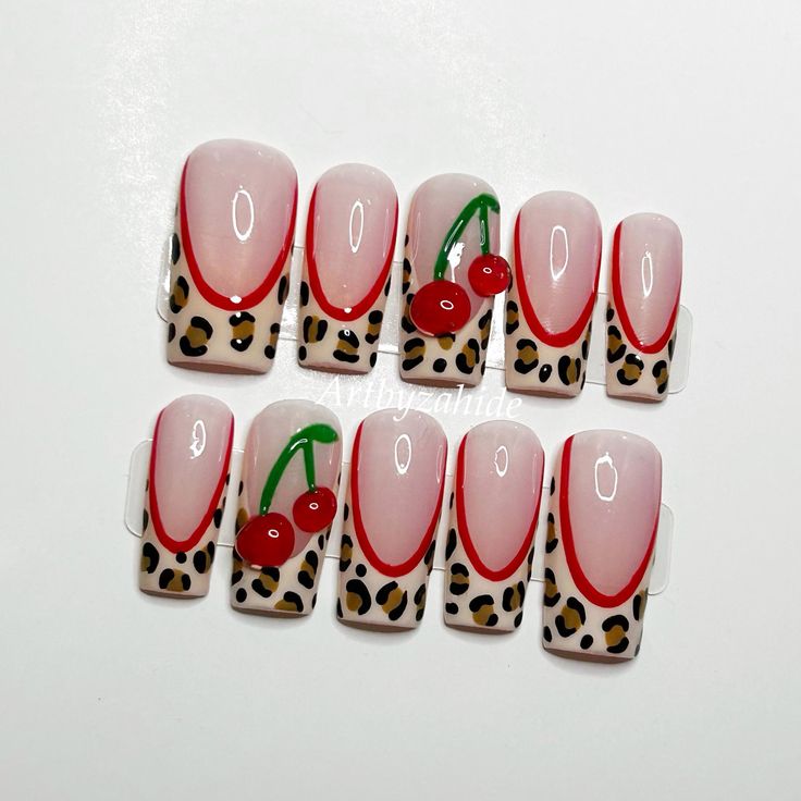 Playful Leopard Print and Cherry Motifs Nail Design with Striking Visual Appeal.