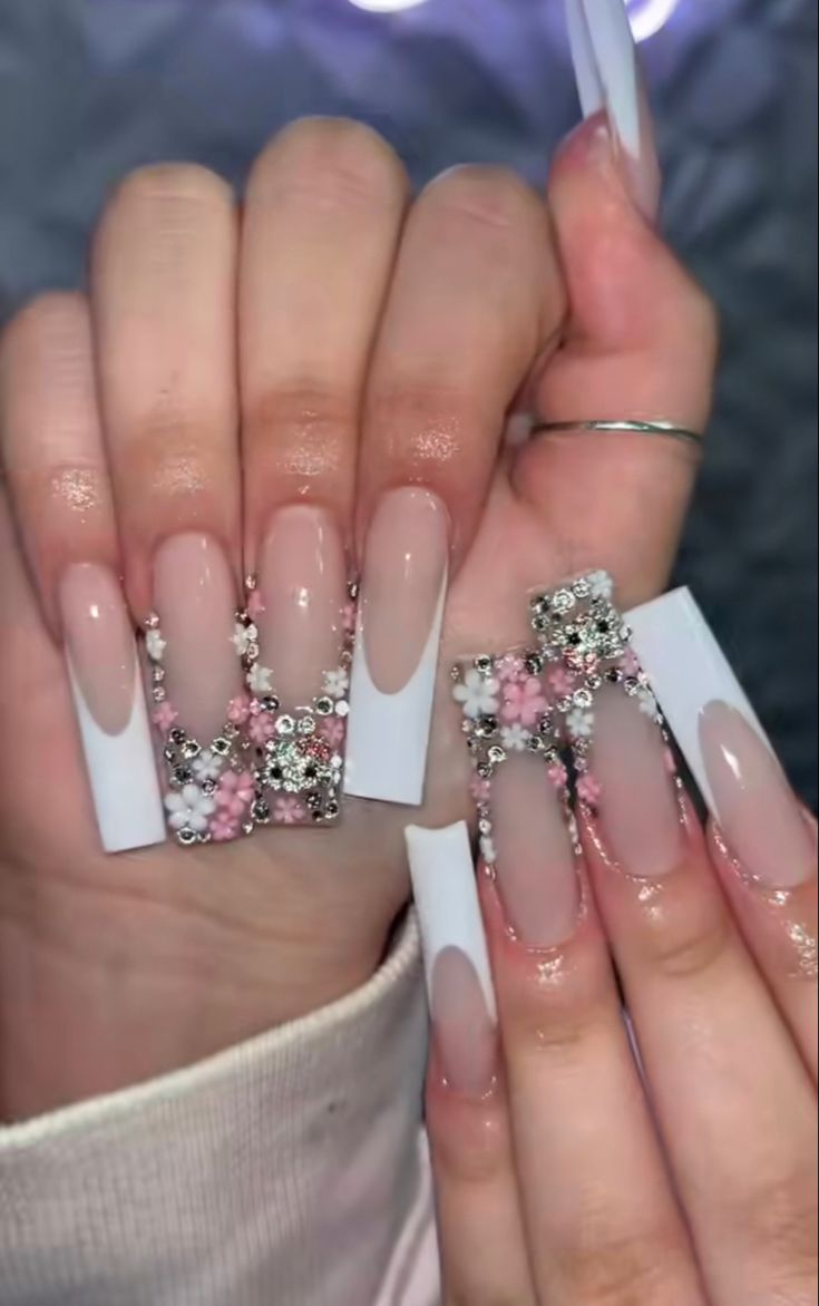 Luxurious Pink and White Floral Nail Design with Long Square Tips and Sparkling Embellishments