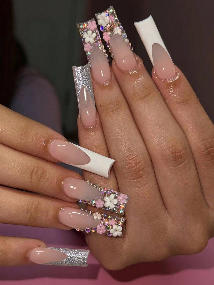 Elegant Nail Design: A Chic Blend of Soft Pinks, Whites, and Eye-Catching Embellishments.