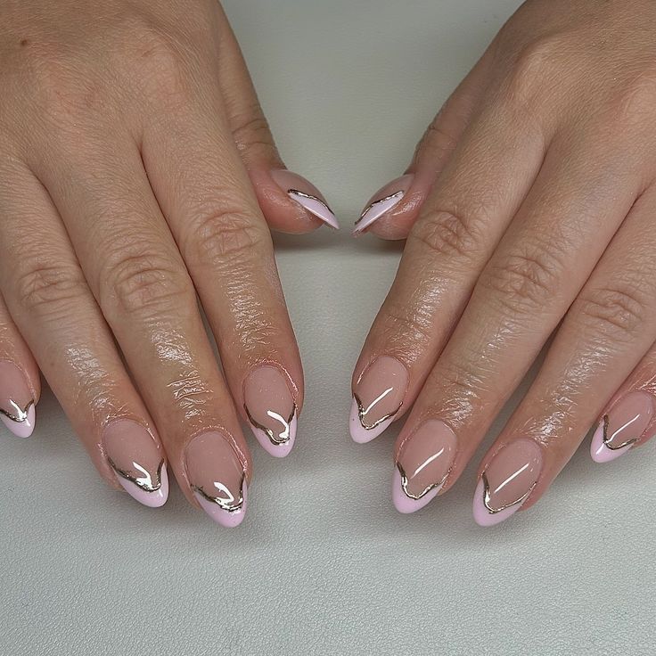 Chic Soft Pink Nail Design with Glamorous Gold Foil Accents.