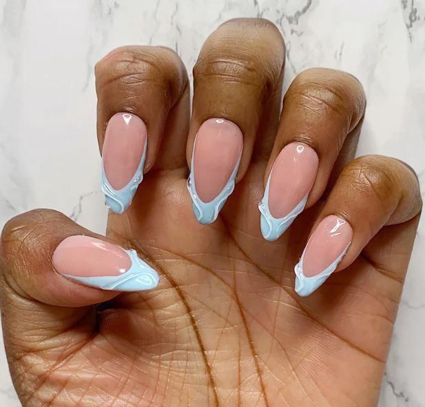 Stylish Soft Pink Base with Glossy Light Blue French Tips and Artistic Wave Pattern.