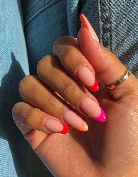 Vibrant Ombre Almond Nails: Soft Peach to Bold Pink and Red Matte Finish.