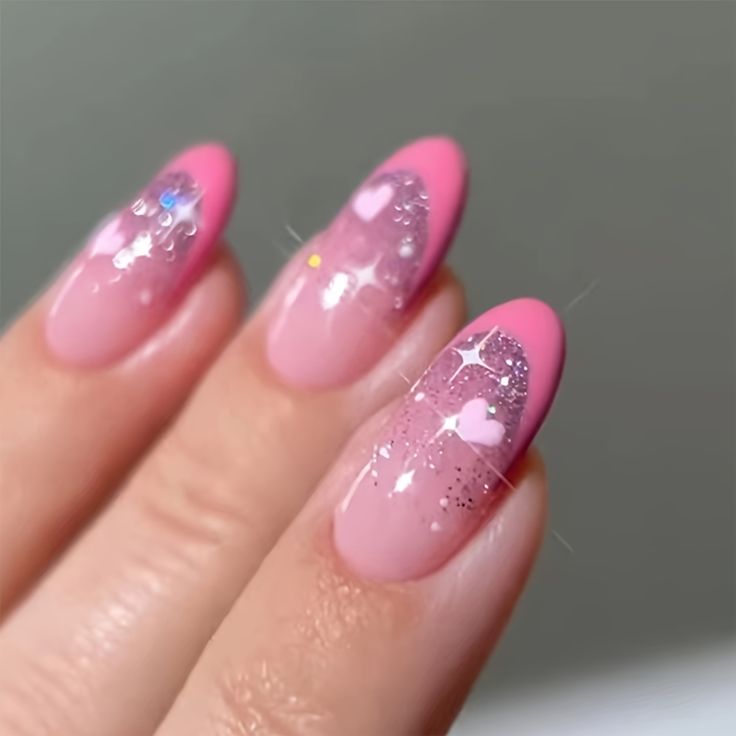 Charming Pastel Pink Ombre Nail Design with Glitter, Hearts, and Star Accents.