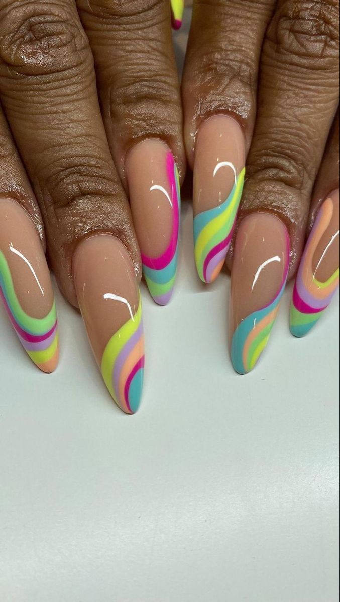 Bold Multicolored Swirls on Soft Nude Nails Create a Playful Statement Design.