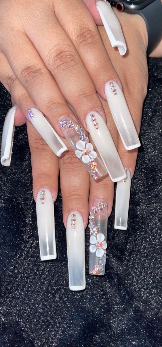 Chic and Glamorous Long Nails with Elegant Floral Designs and Gemstone Accents.