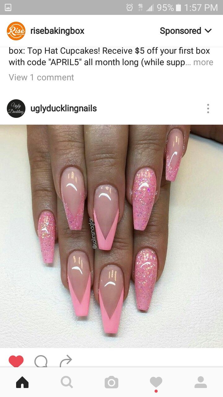 Elegant Almond-Shaped Nail Design with Soft Pink, Glitter Accents, and Striking V-Shaped Details.