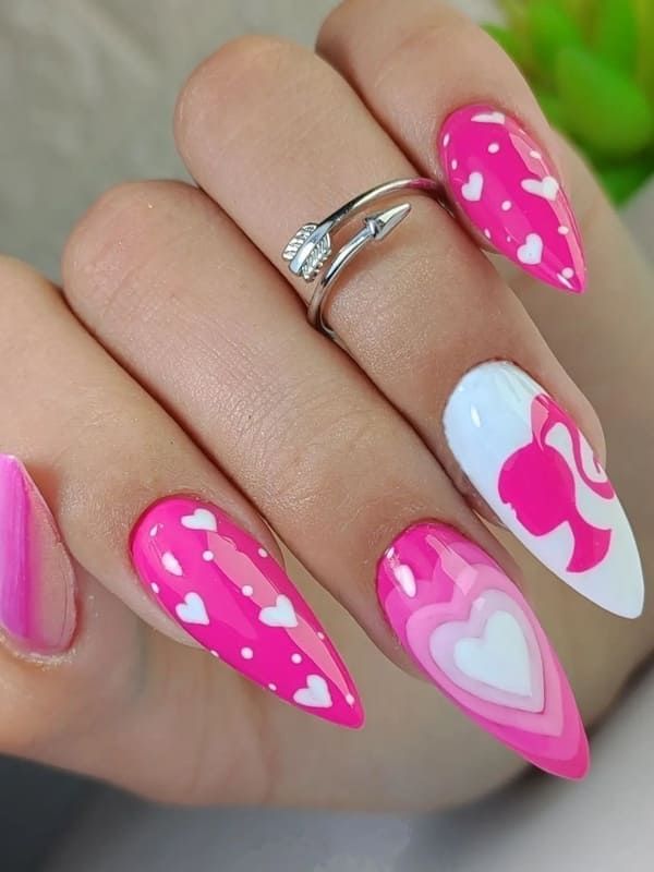 Charming Pink Nail Art with Heart Patterns and Dynamic Finishes for Romantic Occasions