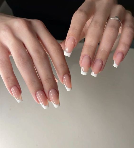 Sophisticated French Manicure: Classic Elegance with Soft Pink Base and White Tips.