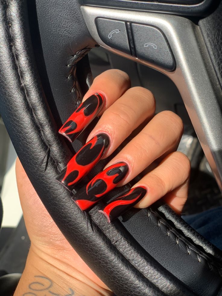 Bold Flame-Inspired Nail Design in Striking Red and Black.