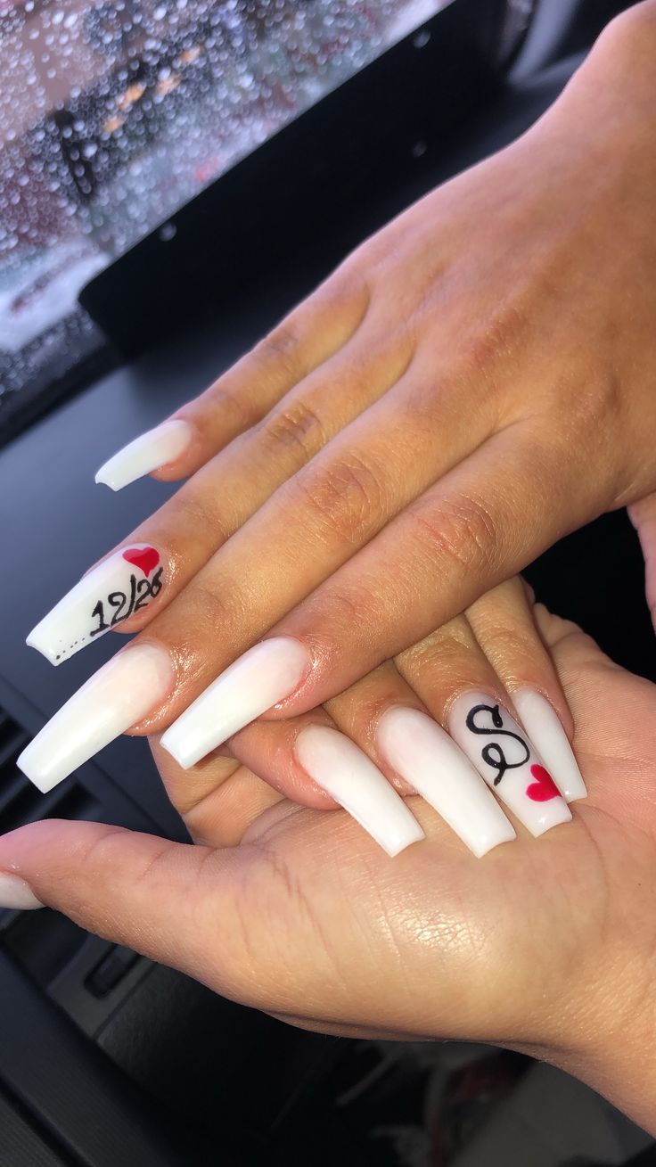 Chic Long White Square Nails with Red Hearts and Bold Black Accents