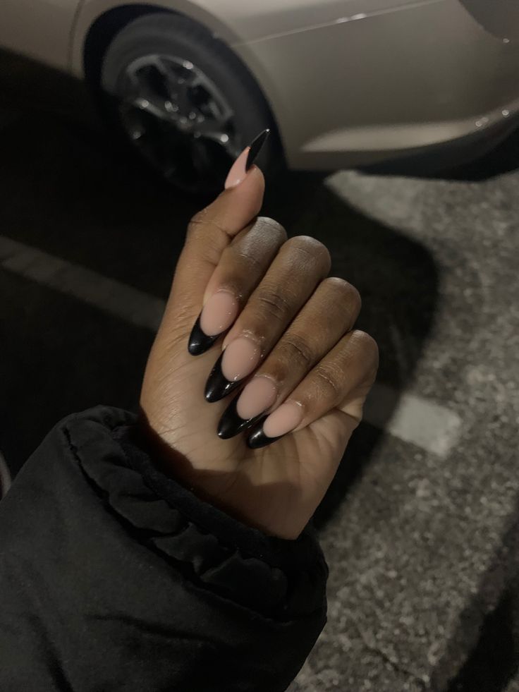 Chic Ombre Stiletto Nails: Soft Nudes Transitioning to Bold Black Tips