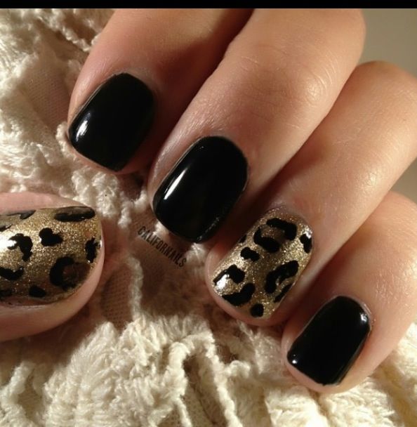 Bold Black and Shimmering Gold Leopard Print Nail Design for a Trendy Statement.