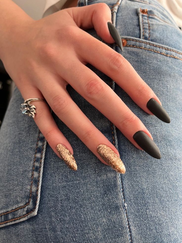 Bold and Glamorous: Elegant Matte Black and Shimmering Gold Nail Design