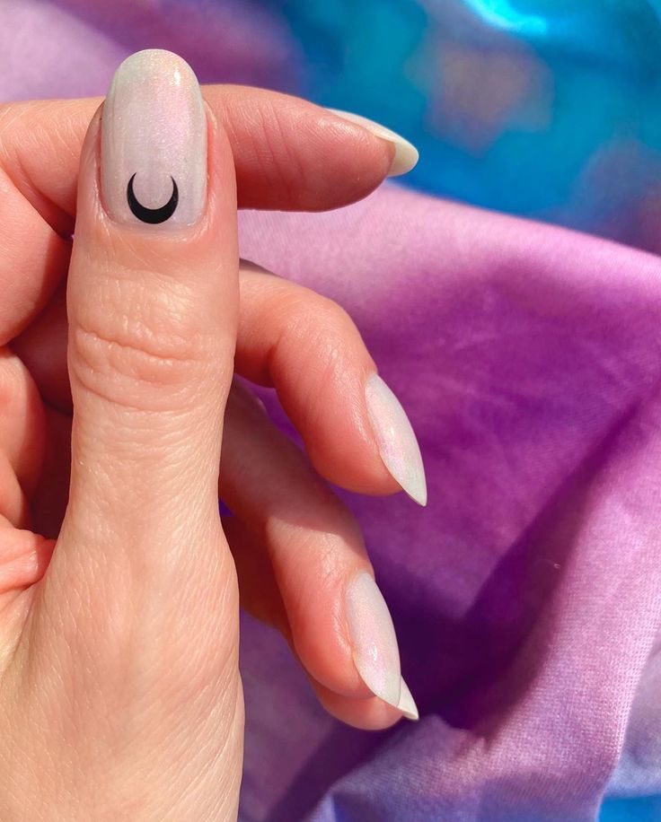 Minimalist Crescent Nail Design with Soft Iridescent Finish and Subtle Shimmer.