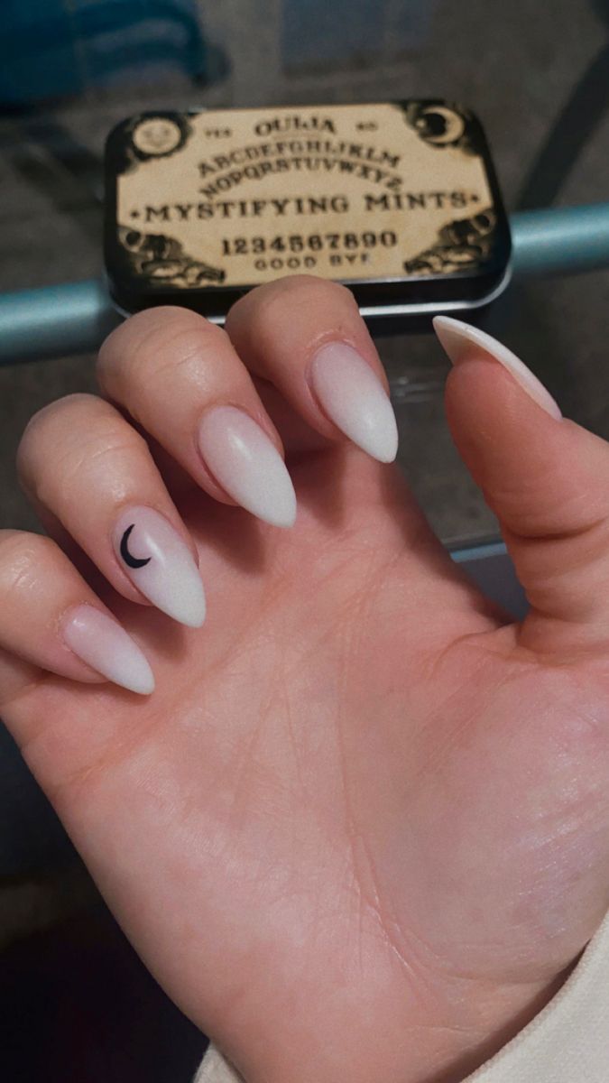 Chic Ombre Almond Nails with Delicate Crescent Moon Accents.