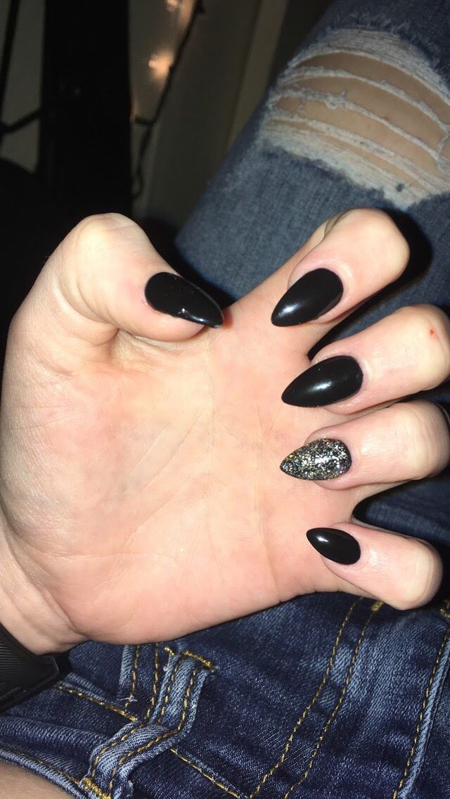 Chic Black Stiletto Nail Design with Glamorous Glittered Accent