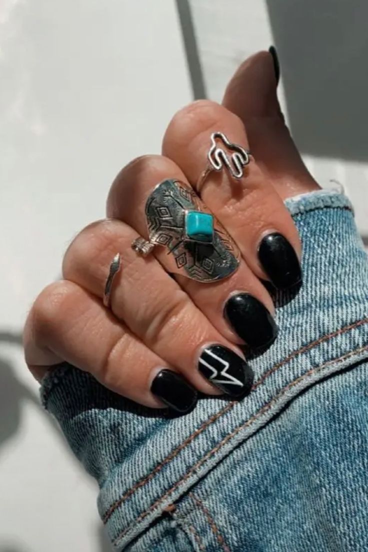 Modern Black and White Geometric Nail Design with Edgy Silver Accents.