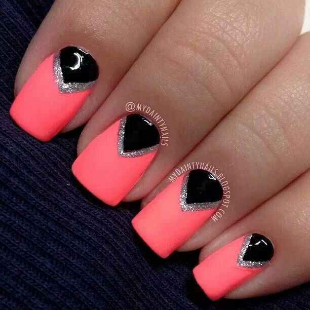 Chic Neon Pink and Black Geometric Nail Design with Silver Accents.