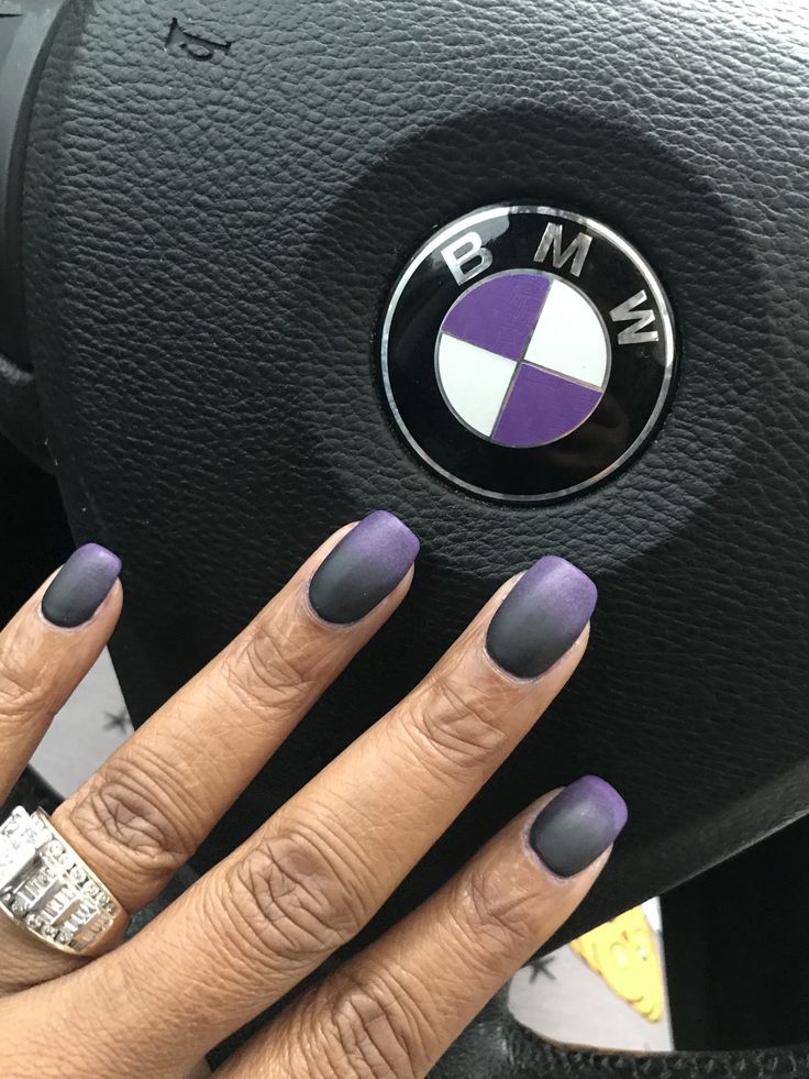 Elegant Matte Purple Gradient Nail Design Complementing a Sleek Car Interior.