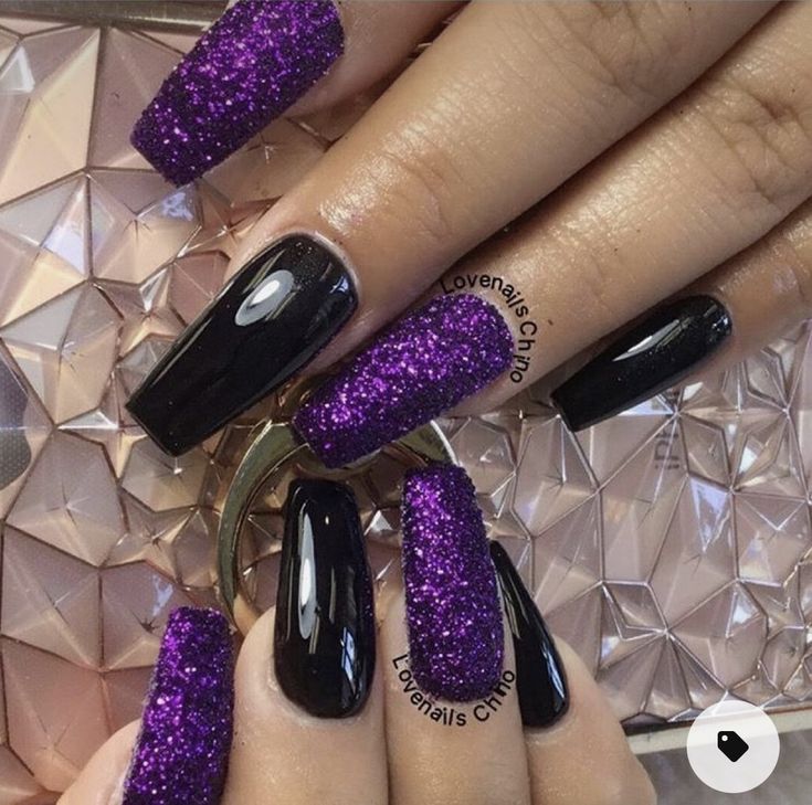 Glamorous Nail Art: Striking Purple and Black Design with Glitter for Special Occasions.