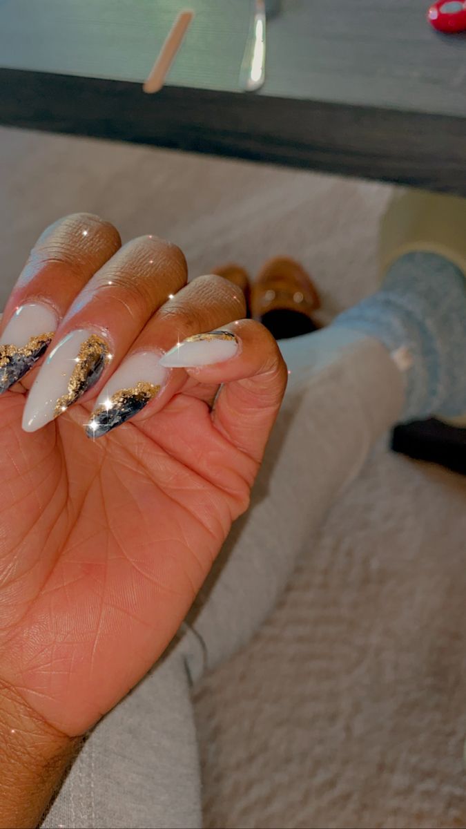 Sophisticated Elegant Nail Design in White, Black, and Gold Accents.