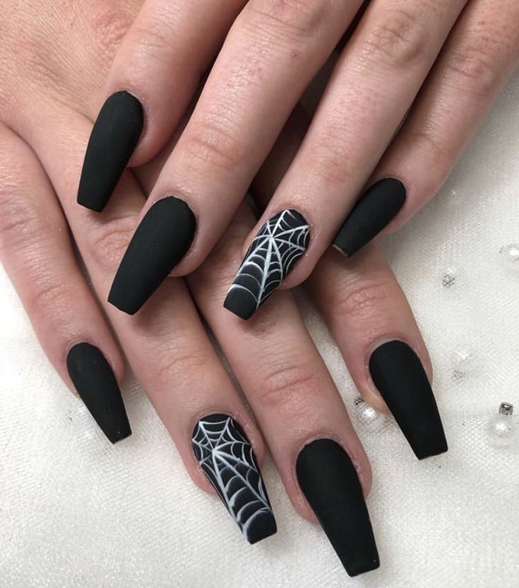 Bold Matte Black Nails with Striking Spider Web Design for Edgy Statement Manicure.