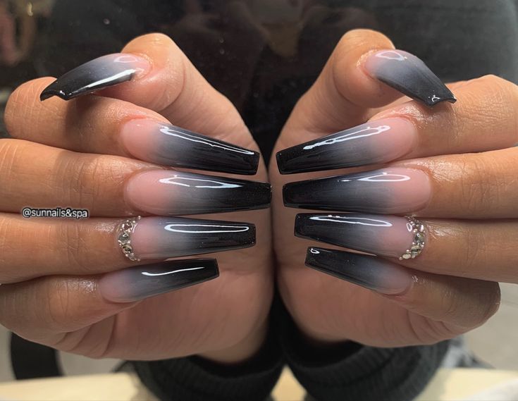 Elegant Ombre Nail Design: Striking Black and Soft Nude with Rhinestone Accents