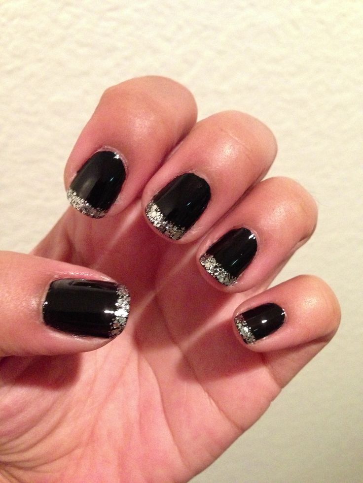 Chic Black Nails with Sparkling Silver Tips for Glamorous Style.