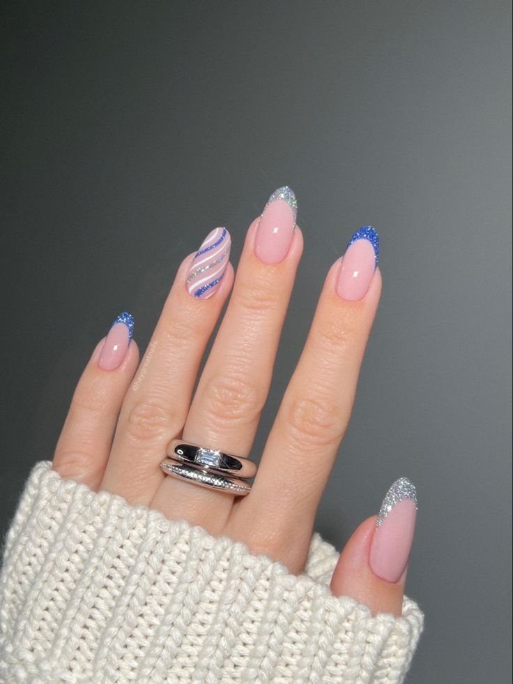 Sophisticated Soft Pink Nail Design with Playful Glitter Accents and Trendy Stripes.