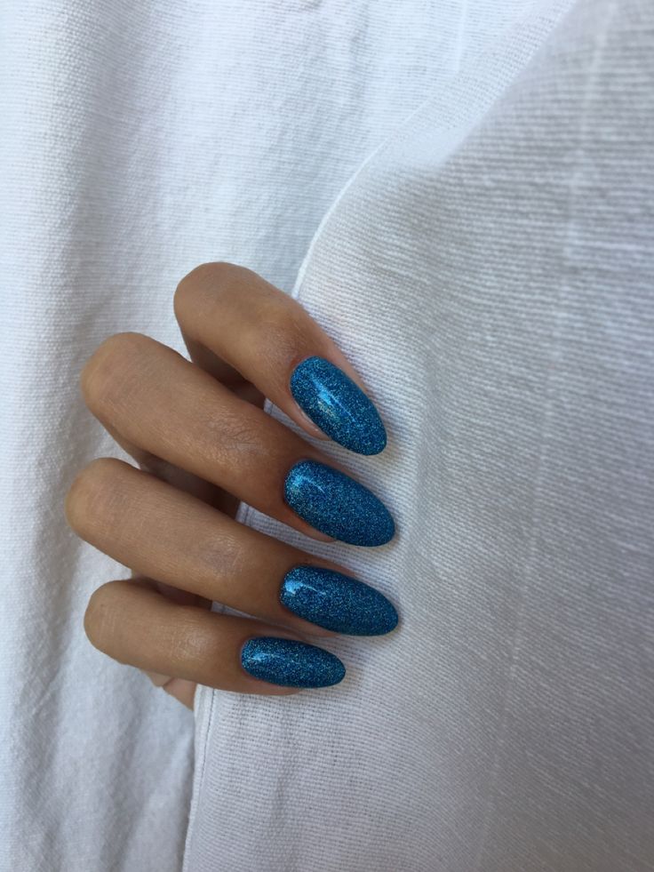 Bold Sparkling Blue Almond-Shaped Nails: Elegance Meets Glamour for Any Occasion.